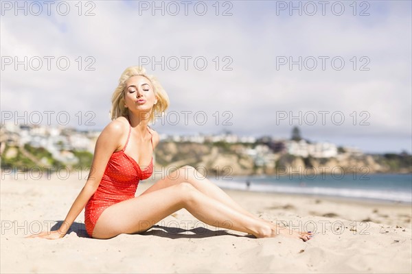 Portrait of blond woman on beach