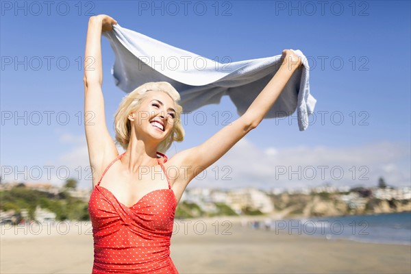 Portrait of blond woman on beach