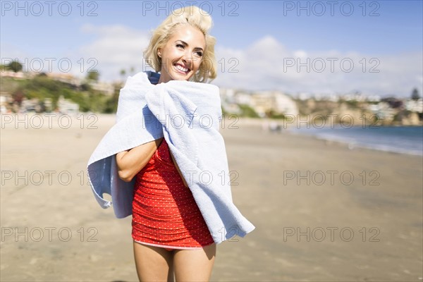 Portrait of blond woman on beach