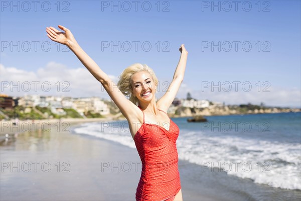 Portrait of blond woman on beach