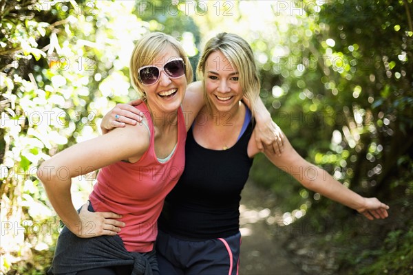 Portrait of two blond women in forest