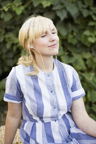 Woman contemplating in garden