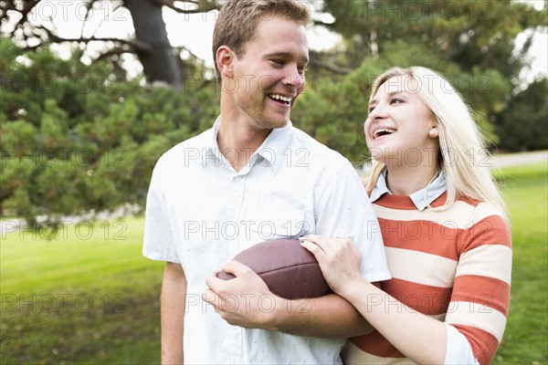 Portrait of young couple in park