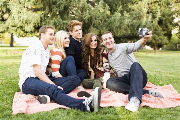 Friends taking selfie in park