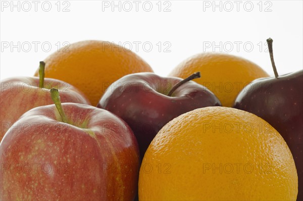 Studio shot of apples and oranges