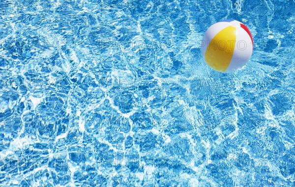 Beach ball in swimming pool