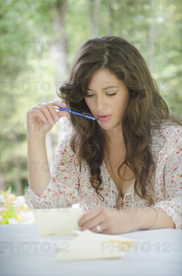 Young woman writing letter