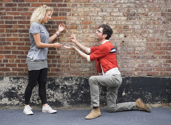 Man proposing to woman.