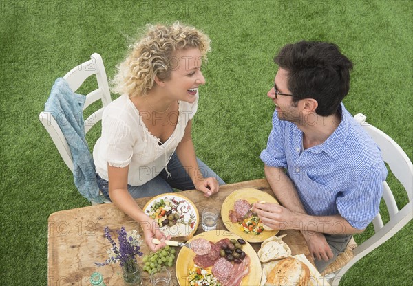 Couple having rustic breakfast.