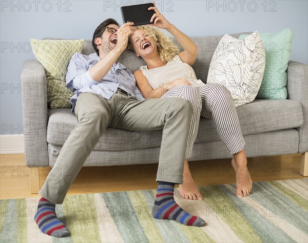 Couple using tablet pc.