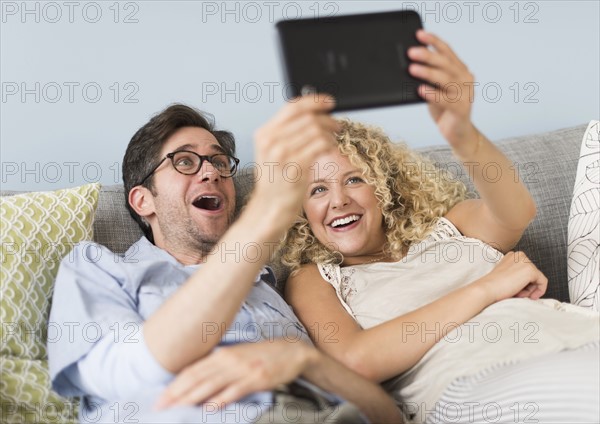 Couple using tablet pc.