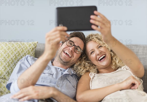 Couple using tablet pc.