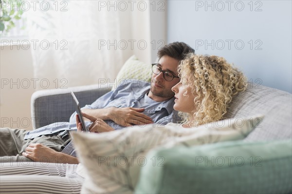 Couple using tablet pc.