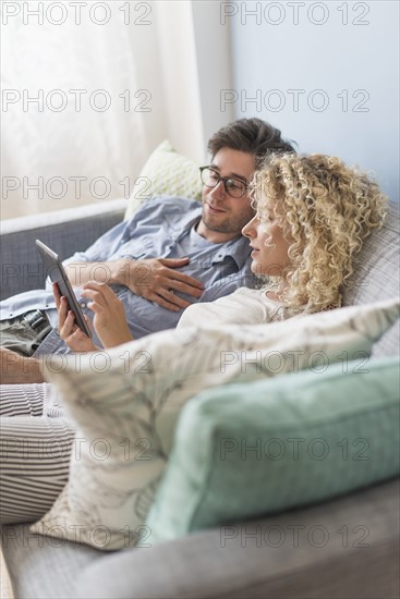 Couple using tablet pc.