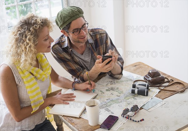 Couple making plans for travel.