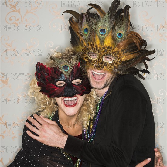 Portrait of couple wearing holiday costumes.