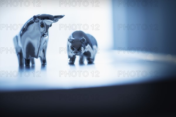 Close-up of ceramic bull and bear.