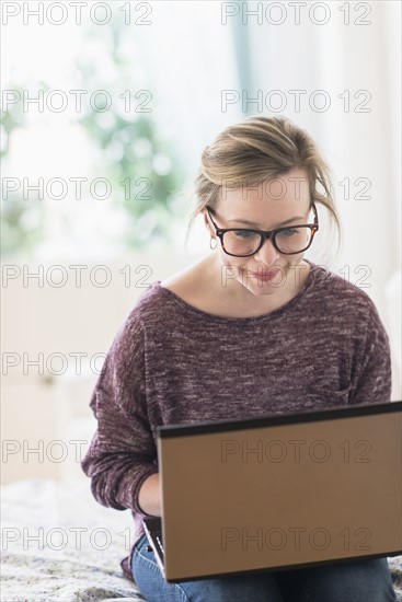 Young woman using laptop.