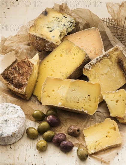 Selection of cheese on wooden table, studio shot.