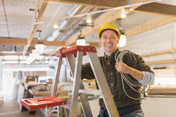 Portrait of electrician in hardhat.