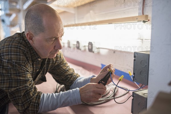 Electrician fixing wires.