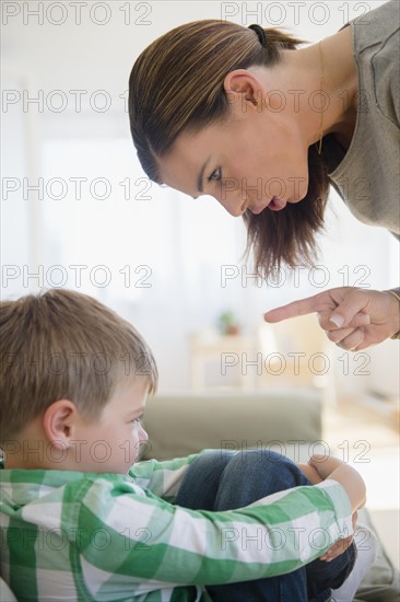 Mother giving lecture to son (6-7)