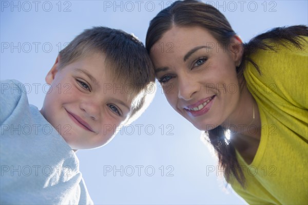 Portrait of mother and son (6-7) outdoors