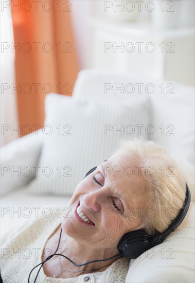 Senior woman listening to music