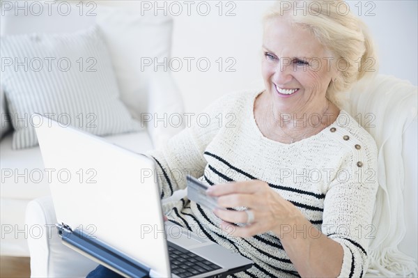 Senior woman doing on-line shopping