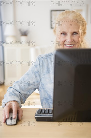 Senior woman using computer