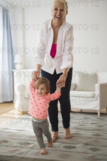 Portrait of grandmother playing with granddaughter ( 2-3 )