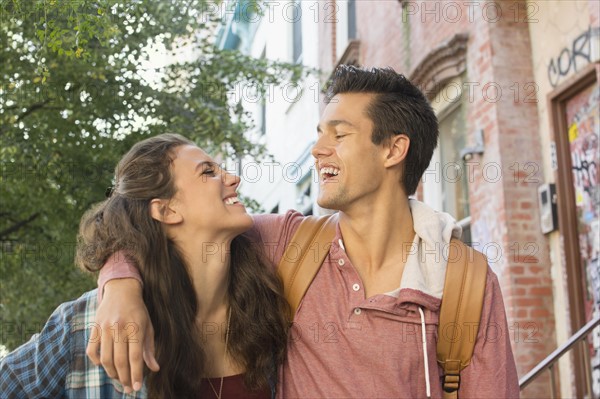 Young couple walking on street