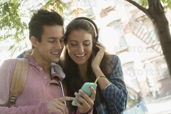 Young couple listening to music