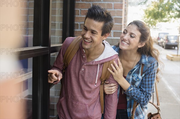 Young couple walking on street