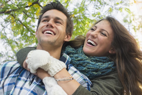 Man giving piggyback ride to his girlfriend