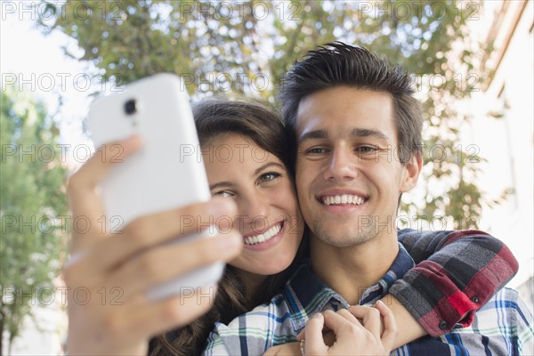 Young couple taking selfie