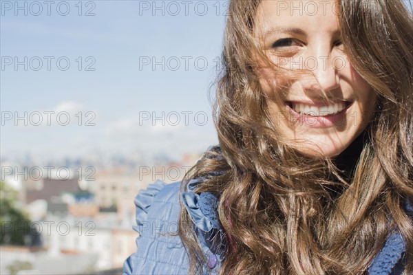Portrait of young woman on roof