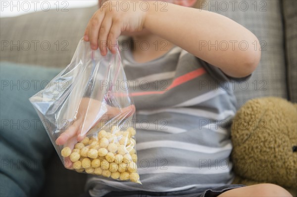 Boy (2-3) eating cereals