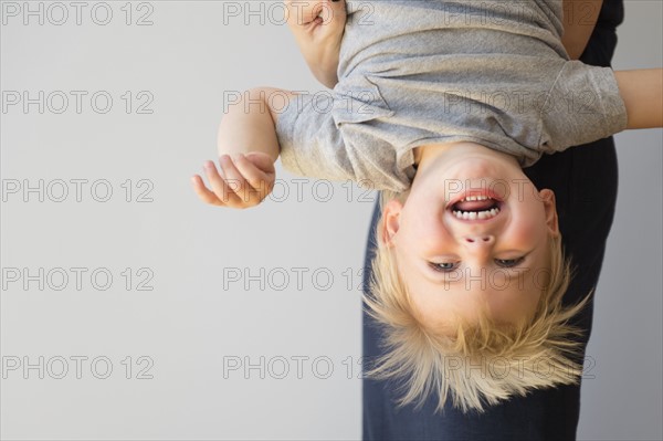 Portrait of boy (2-3) upside down