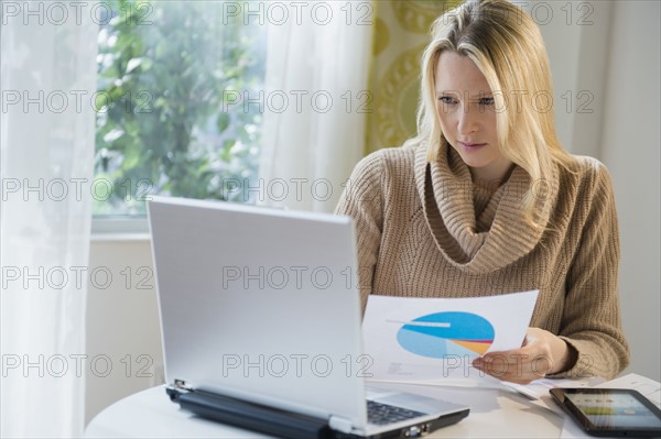 Blond woman working from home