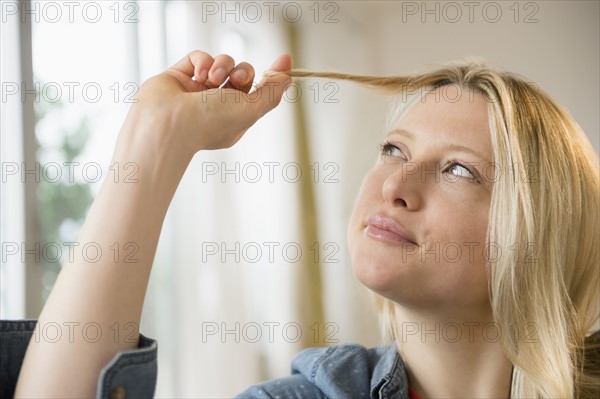 Woman twisting her hair