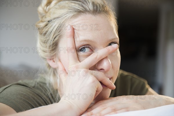 Woman with hand on her face