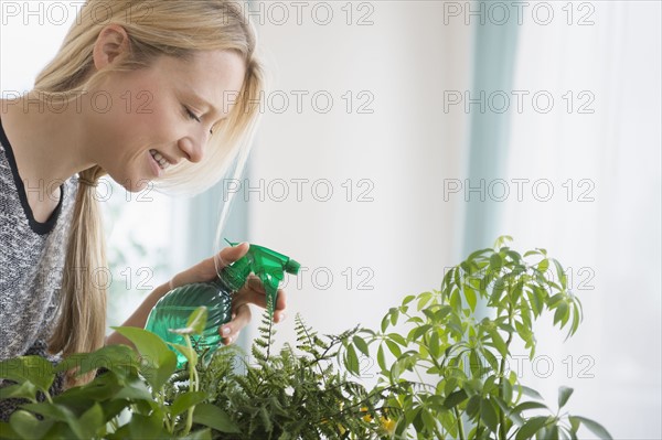 Woman spraying plants