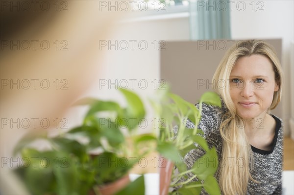 Portrait of woman reflecting in mirror