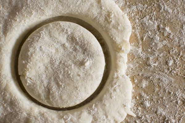 Circle cut out from fresh dough