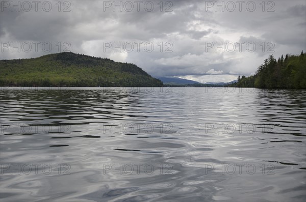 Scenic view of lake on cloudy day