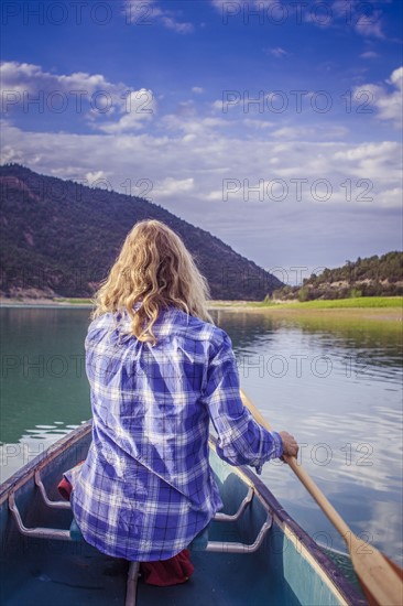 Woman canoeing in lake