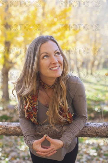 Portrait of smiling woman in forest