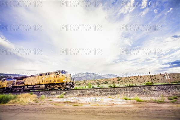 Train on railroad tracks in countryside