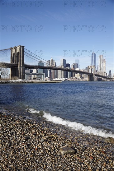 View of suspension bridge and cityscape